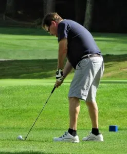 Man playing at the Shirley Kane Memorial 4-H Golf Tournament
